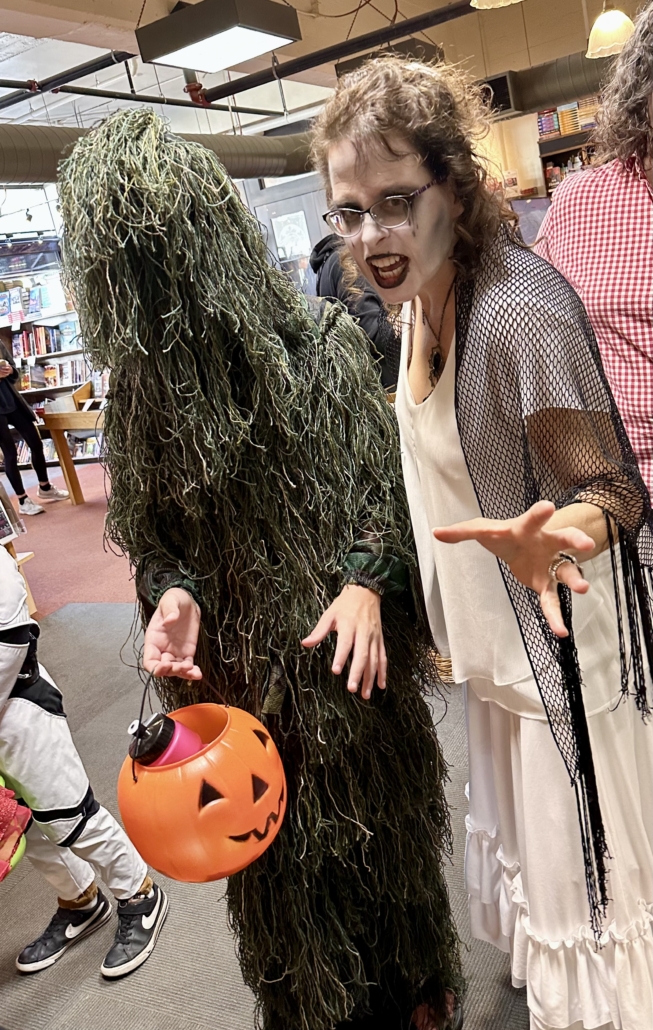 Author Silvia Acevedo in costume greeting costumed kids after reading her spooky tale from THE HAUNTED STATES OF AMERICA book